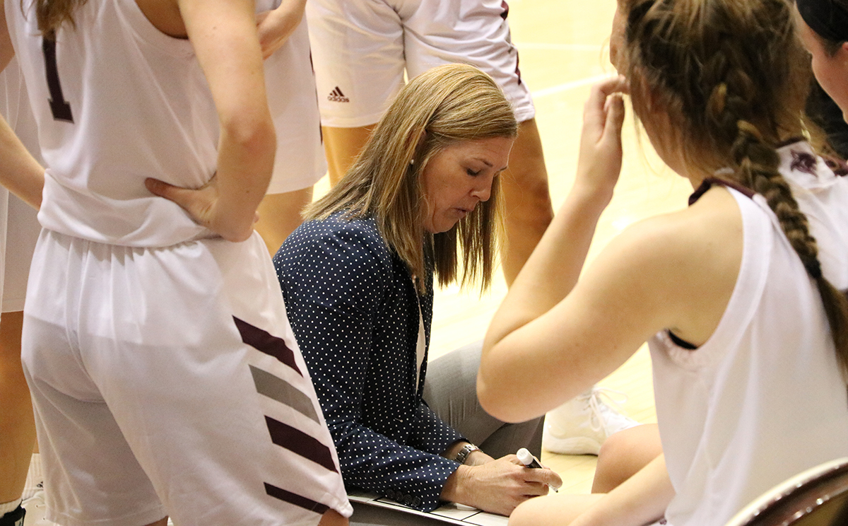 Coach Mullis going over a plan with the Team